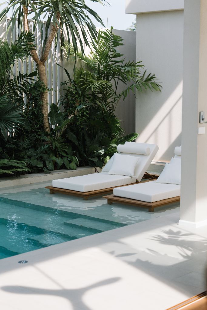 Sunroom villa poolside with sun loungers