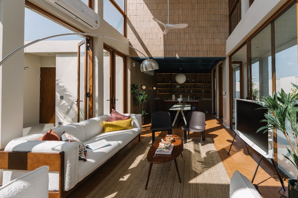 Sunroom open living room with tall void